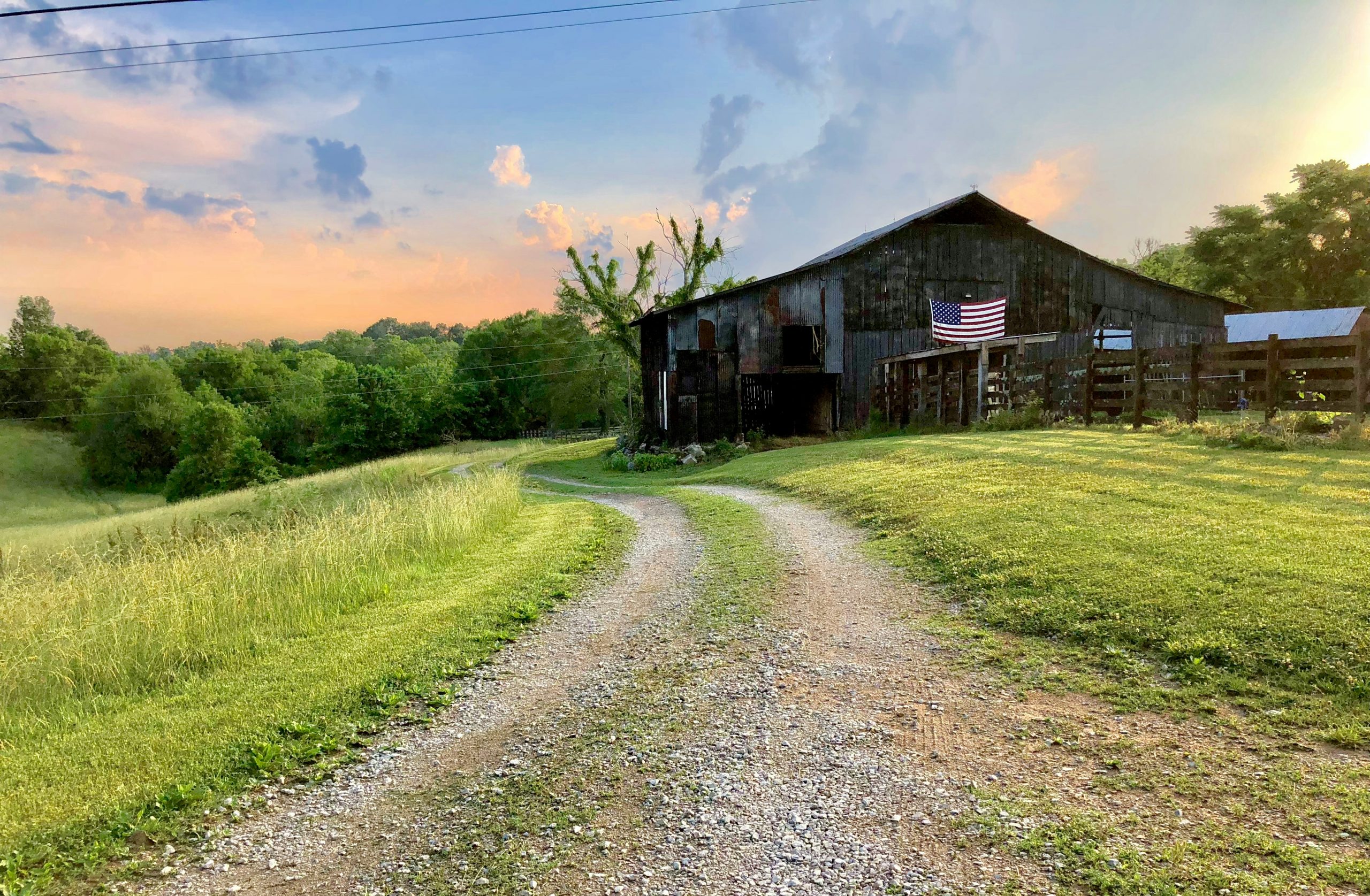 patriotic flag of America on farm building on farm